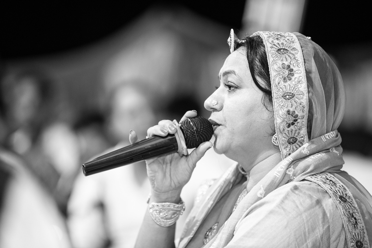 singer, aasha vaishnav, indian singer, stage performance, bhajan, song, black and white, portrait