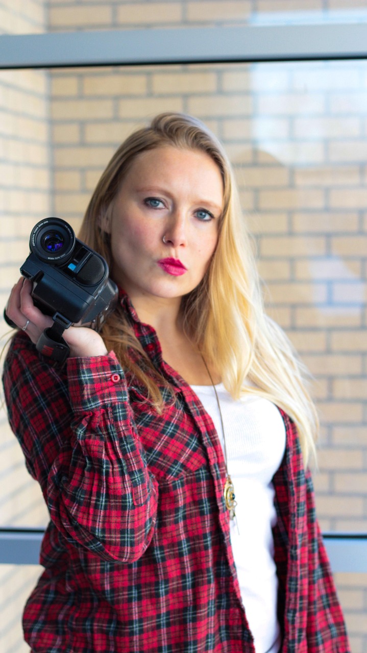 video camera, flannel, woman, videographer, blonde, portrait