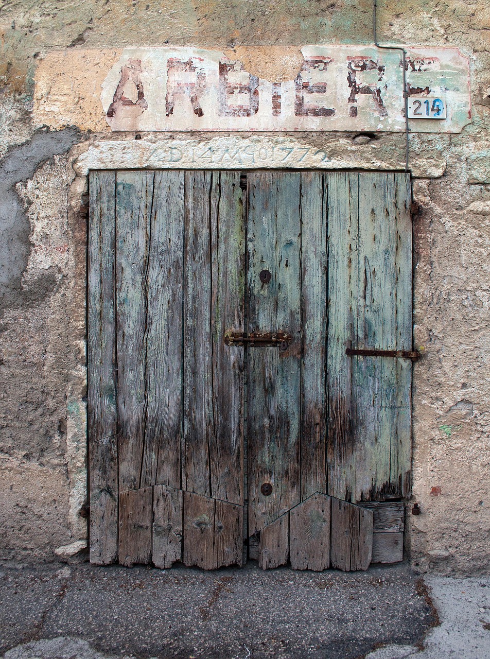 door, old, barber shop, old barber's shop, doorway, dilapidated, repaired doors, stone lintel, carved date, retro, gray shopping, gray shop, gray door, gray retro, gray old, gray stone