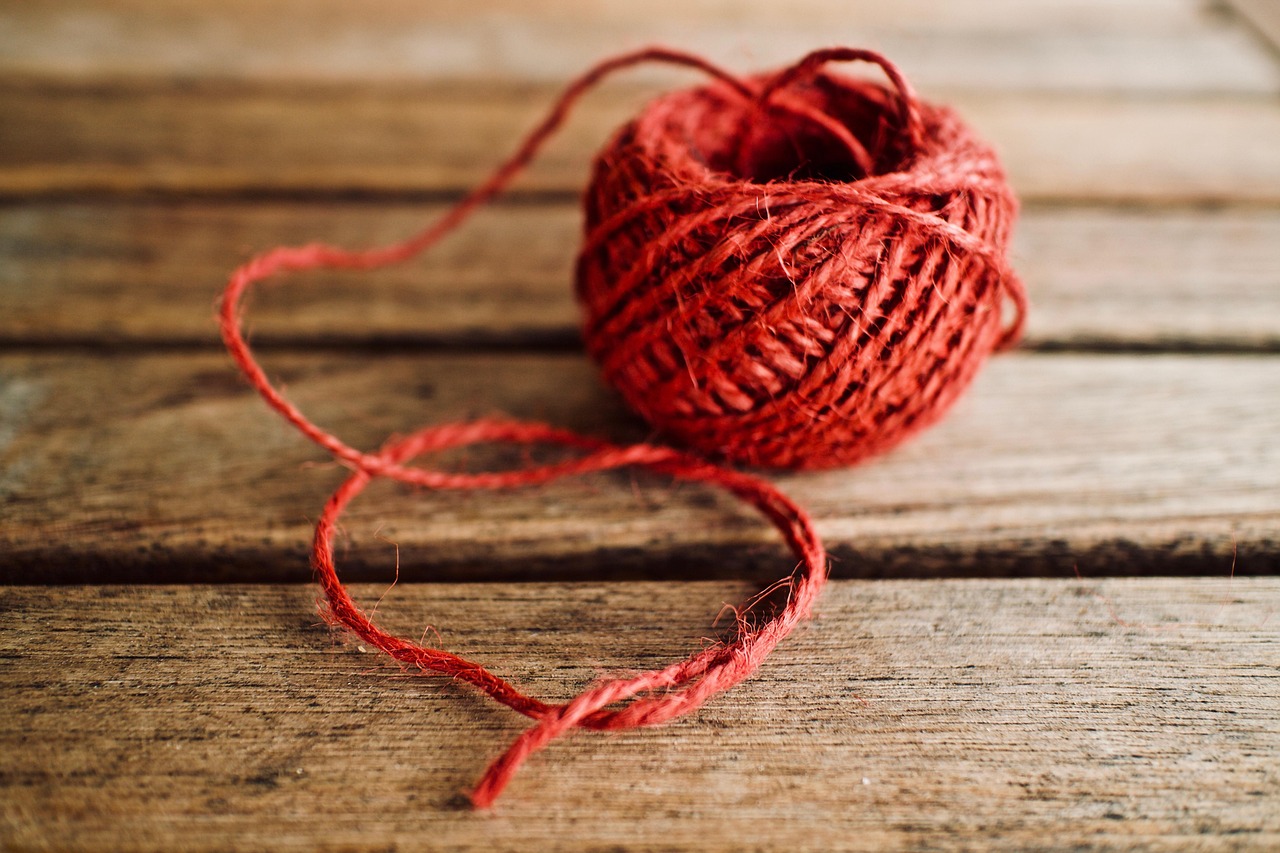 fiber, yarn, skein, red yarn, wool yarn, closeup