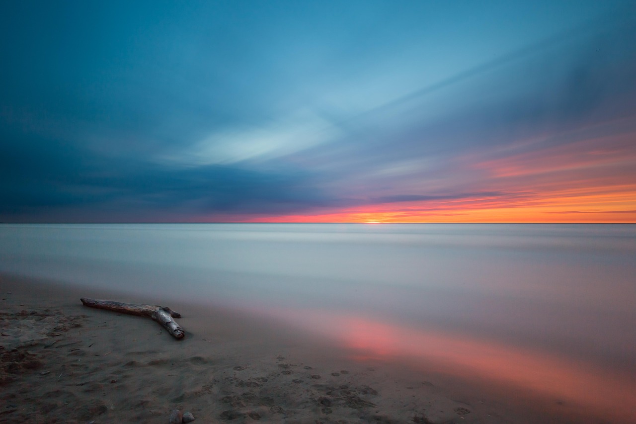 beach, driftwood, sunset, ocean, calm waters, dawn, dusk, horizon, landscape, log, nature, reflection, sand, sea, seascape, seashore, sky, long exposure