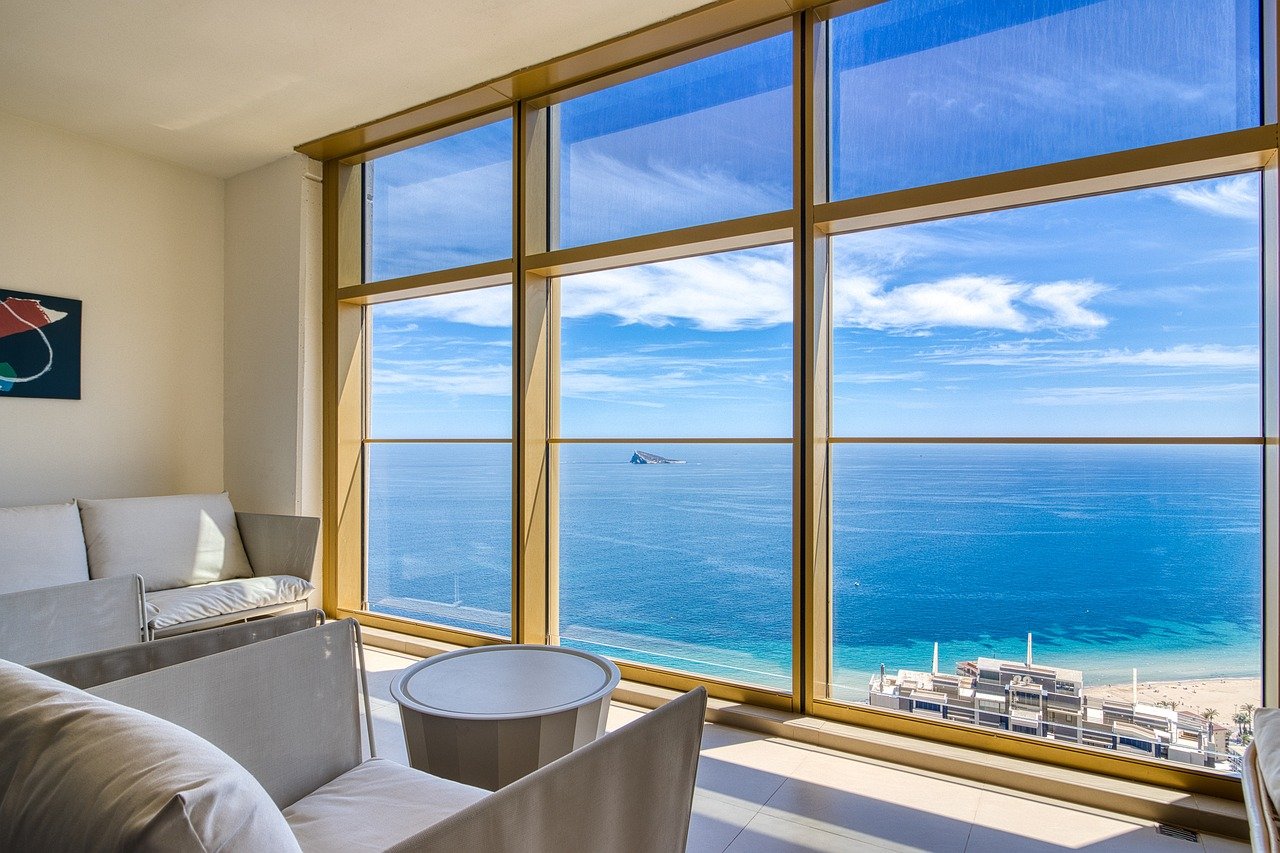 seaview apartment, panoramic view, luxury interior, modern living room, costa blanca property, beachfront apartment, mediterranean lifestyle, real estate photography, ocean view, contemporary design