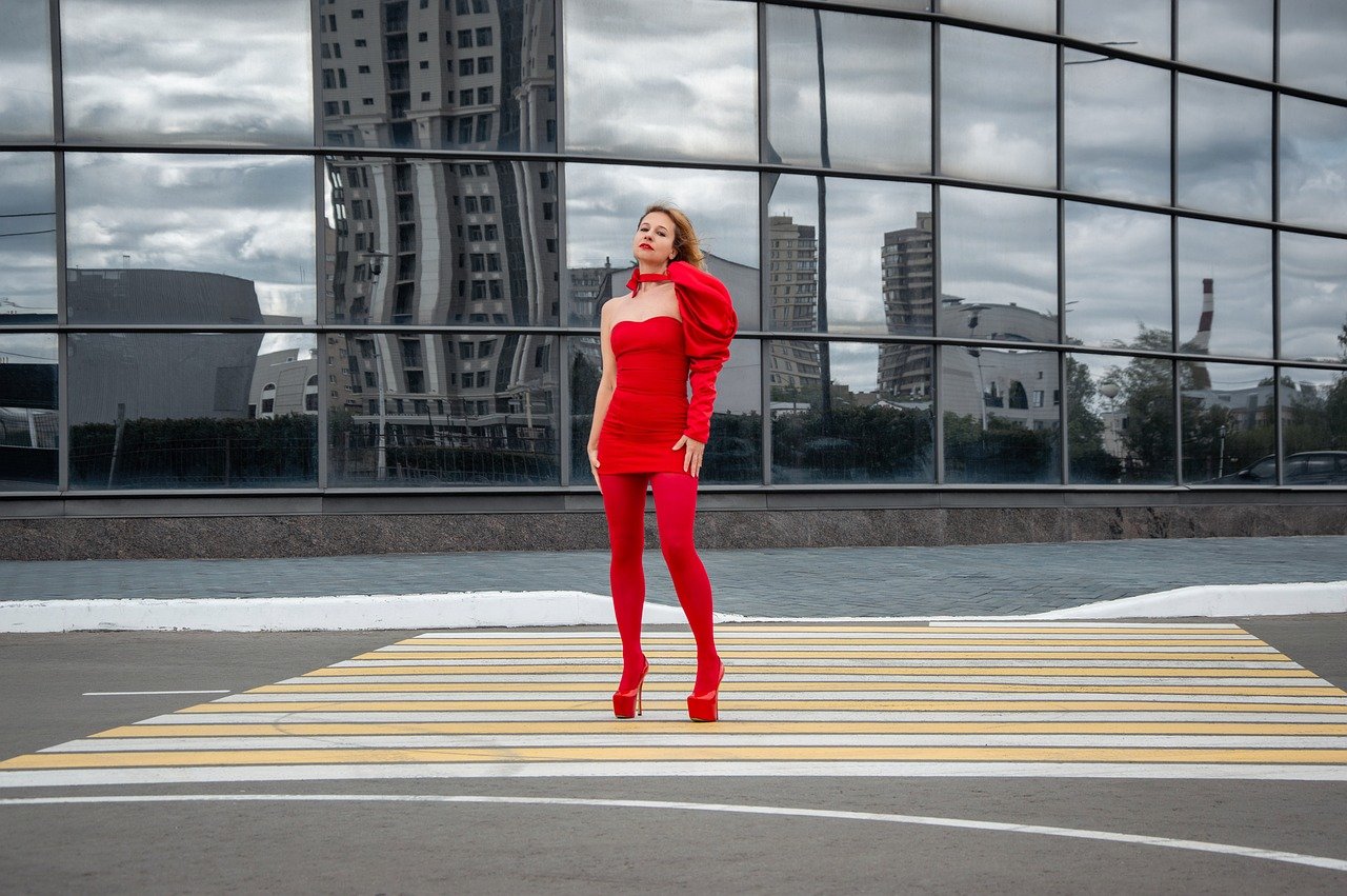 woman, skyscraper, asphalt, parking lot, crosswalk, red tights, red dress, model, posing, fashion, style, brightly, red shoes, red clothes
