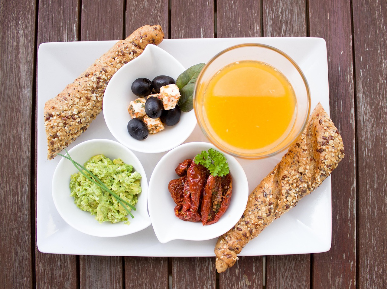 breakfast, orange juice, loaf, whole wheat, whole grain bread, guacamole, nourishment, yummy, meal, breakfast table, have breakfast, plate, healthy, tasty, food, vitamins, in the morning