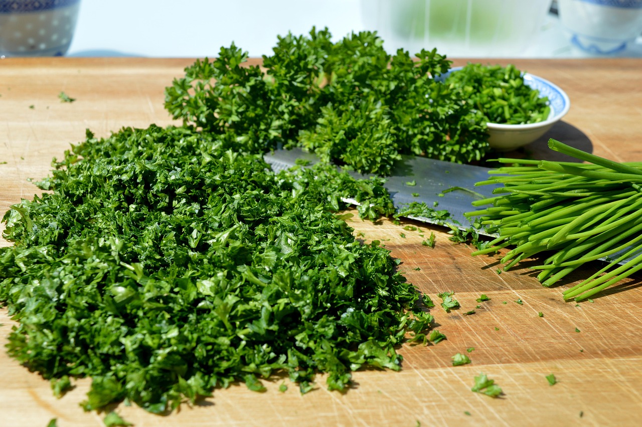 herbs, cutting board, knife, parsely, parsley, chives, healthy, spices, green, cook, wood cutting board, wooden board, garden herbs, chopped parsley