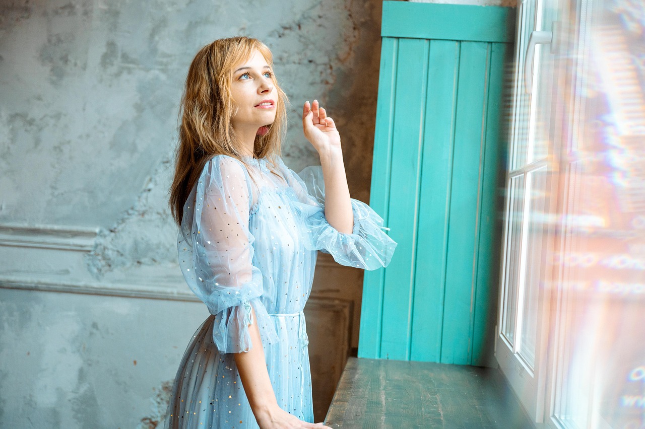 woman, dress, blonde, model, pose, hands, romantic, fashion, style, stars, glamor, human, tenderness, portrait, elegantly, blue, sequins, touch, interior, glare, bokeh, reach out, rays of light